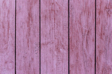 Naklejka premium Rustic wood texture or background with scratched pink paint.