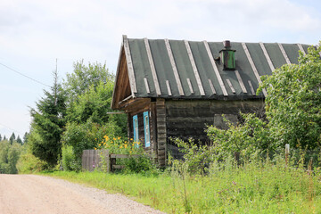 Old wooden house on the street in russian village