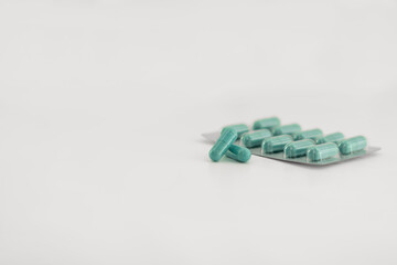Pile of scattered capsules on a white background. capsules isolated white capsule pharmacy bottle pill drug concept
