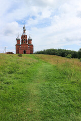 Fototapeta na wymiar Beautiful Transfiguration Church made from red brick near the Volga source. Russia
