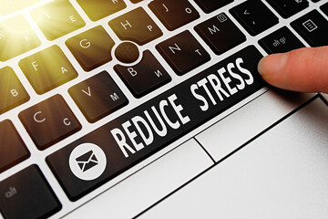 Conceptual hand writing showing Reduce Stress. Concept meaning to lessen the state of mental or...