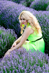 a woman in the middle of a lavender Bush