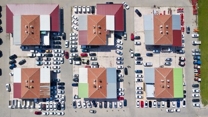 Aerial view of brand new and second hand car dealers site