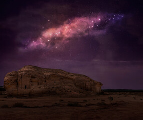 Mada'in Saleh archaeological site with starry night sky, near Al Ula, Saudi Arabia