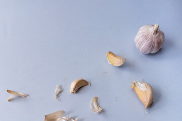 garlic lies on a gray background. Photographed at close range. . High quality photo
