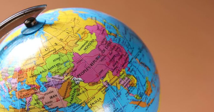 Globe turning close up the isolated background