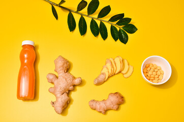 Ginger in different conditions: fresh, dry root, pills and cut plant on pastel yellow orange background.