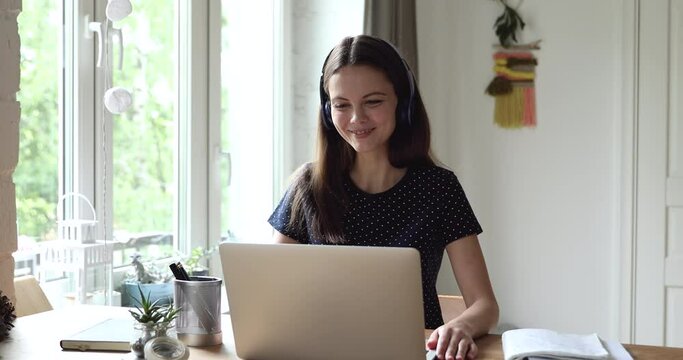 Young teacher lead online class talk to learner distantly wear headphones using pc video call videoconference application. Easy convenient method of study, gain knowledge by virtual services concept