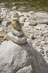 Fototapeta na wymiar Balanced stones on a pebble beach. concept of balance and harmony.
