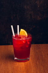 Cocktail on rustic background with space for text. Vertical shot.