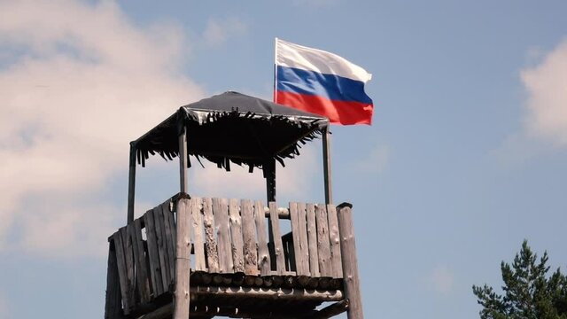 Russian flag on a wooden tower