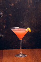 Fruit Martini on rustic background with space for text. Vertical shot.