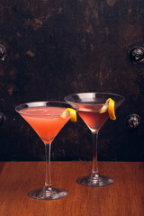 Fruit Martinis on rustic background with space for text. Vertical shot