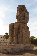 Colossi of Memnon Luxor Thebes against the background of dawn in the Egypt