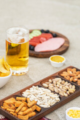 Dry fruits and crackers with a beer mug