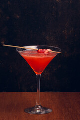 Fruit Martini on rustic background with space for text. Vertical shot.