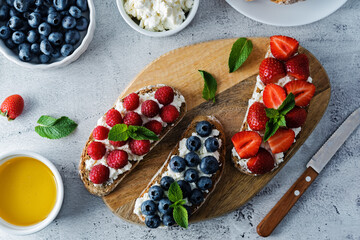 Fresh breakfast with Blueberry, Strawberry and raspberry ricotta rye sandwiches