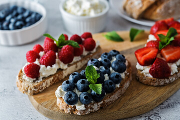 Fresh breakfast with Blueberry, Strawberry and raspberry ricotta rye sandwiches