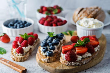 Fresh breakfast with Blueberry, Strawberry and raspberry ricotta rye sandwiches
