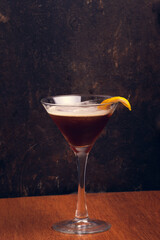 Fruit Martini on rustic background with space for text. Vertical shot.