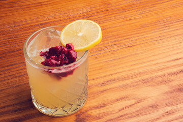 Fruit mixology on wooden table. Warm colored cocktails. 