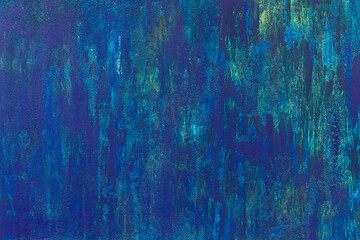 Obraz premium Dark blue patchy weathered uneven painted wall.