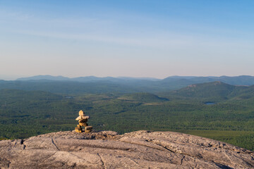 View of an Inukshuk at the summit of "La Chouenne" mountain in Charlevoix, Quebec