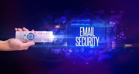 hand holding wireless peripheral with EMAIL SECURITY inscription, cyber security concept
