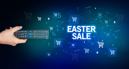 hand holding wireless peripheral with EASTER SALE inscription, online shopping concept
