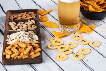 Dry fruits and crackers in a wooden platter