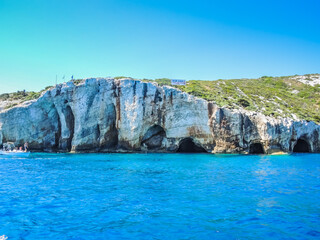Blue Caves on Zakynthos island. Sea and rocks on sunny day in Greece. 