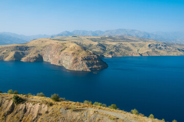 Fototapeta na wymiar Picturesque landscape and lake. Charvak reservoir.