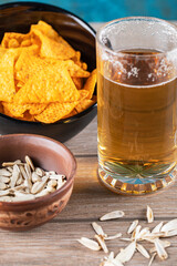 Beer mug with sunflower seeds and chips