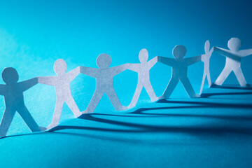 Human team of paper chain people.