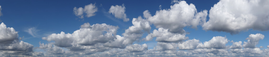 Fototapeta premium Blue summer sky with white cumulus clouds. High resolution panorama of sky with beautiful clouds. Chill out and peace, happiness and hope.