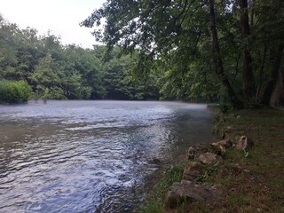 Lake covered with fog after rain
