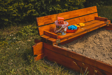 
children's sandpit with toys and molds