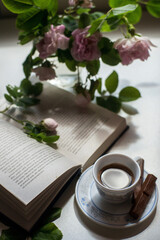 still life with a book and a rose