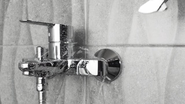 Plumber fixing repairing a leaky shower Bathtub water tap  faucet by wrench tool,  plumbing fix  mount DIY concept