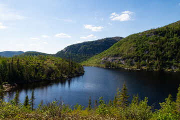 Fototapeta na wymiar View of a peaceful lake in the Grands-Jardins national park, Canada