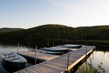Rowing boats tied up at the quay of the Arthabaska lake, in the Grands-jardins national park, Canada