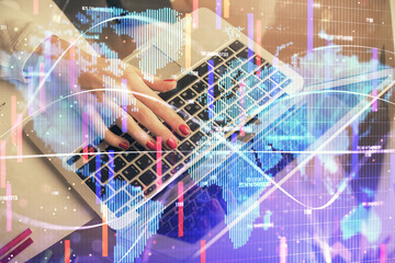 Multi exposure of woman hands typing on computer and business theme hologram drawing. Success concept.