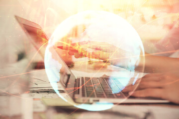 Multi exposure of woman hands typing on computer and business theme hologram drawing. Success...