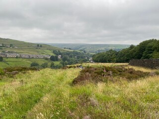 Landscape view over Marsden, from high ground next to Butterley reservoir, with heavy rain clouds in, Marsden, Huddersfield, UK