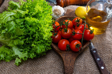 
Raw green and red vegetables on rustic wood