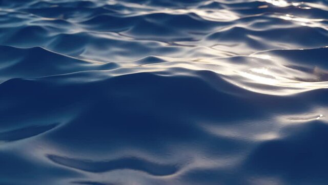 Bright blue sea wave surface in motion