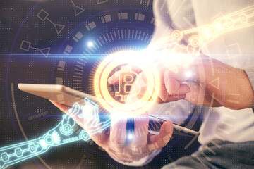Double exposure of man's hands holding and using a phone and crypto currency blockchain theme drawing.