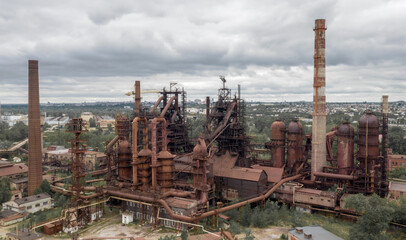 Fototapeta na wymiar aerial photo of an old abandoned steel plant in the natural landscape