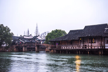 Obraz premium Wuzhen,Tongxiang city,Zhejiang province,Chine. The night view of ancient town,Wuzhen, is a famous historical,cultural and traditional water town.