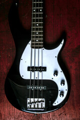 Electric black and white bass guitar